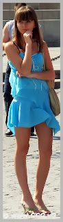 Girl in blue summer dress on the street