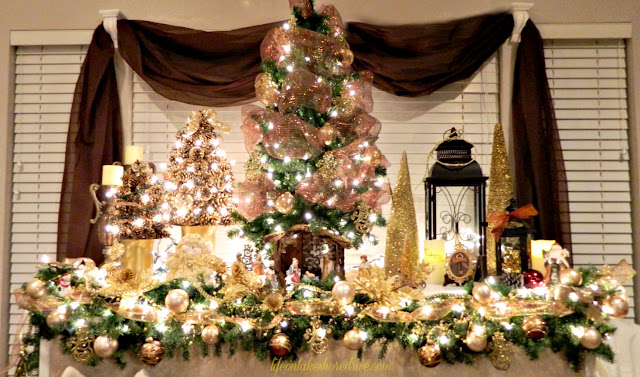 alt="Christmas mantel with pine cone trees and burlap stockings"