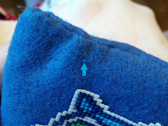 The arrow shows my little thread tag - just work the fabric until it slips back under