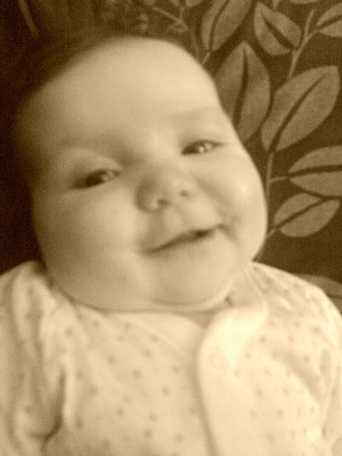 Baby girl sepia photo smile