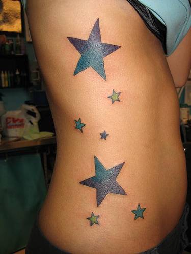 star tattoos on ribs