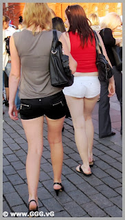 Girls in black and white shorts on the street