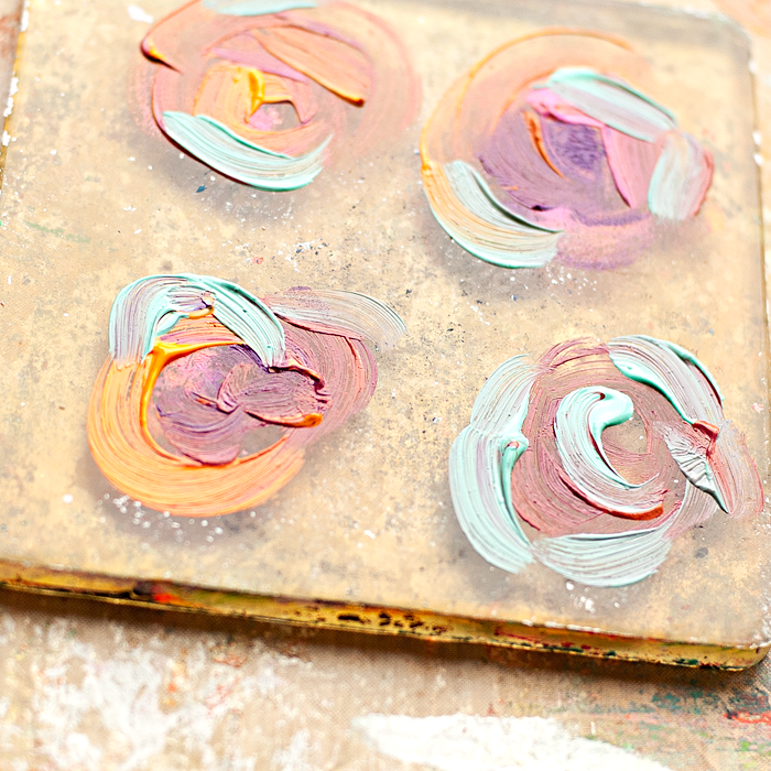 4 step mixed media tutorial using a Gelli Plate and Paint Brushes to paint your print making design onto scrapbook paper