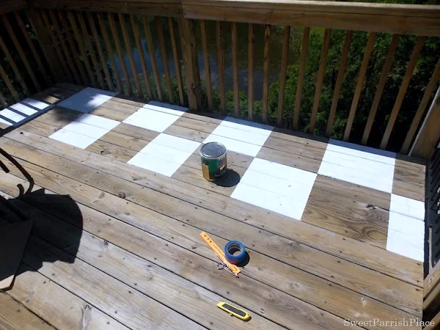 Paint a fabulous patio floor checkerboard floor - by Sweet Parrish Place, featured on I Love That Junk