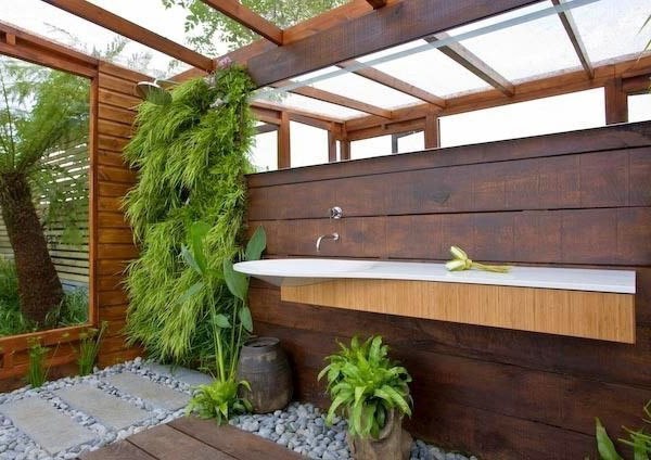 A large horizontal mirror in this garden bathroom by James Wong and David Cubero