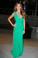Sofia Vergara posing for cameras in a green gown