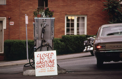 Gas pump with hand-lettered sign reading Closed do to gas shortage