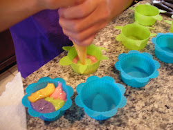 Piping in the various colors of batter