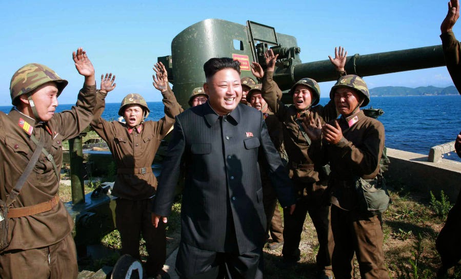 النشاطات العسكريه للزعيم الكوري الشمالي كيم جونغ اون .......متجدد  Kim+jong+un+visits+North+Korean+coastal+Artillery+site+1