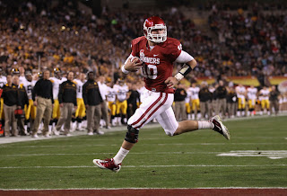 Quarterback Blake Bell #10 of the Oklahoma Sooners scores on a 4 yard rushing touchdown against the Iowa Hawkeyes during the second quarter of the Insight Bowl at Sun Devil Stadium on December 30, 2011 in Tempe, Arizona. The Sooners defeated the Hawkeyes 31-14. (December 29, 2011 - Source: Christian Petersen/Getty Images North America)