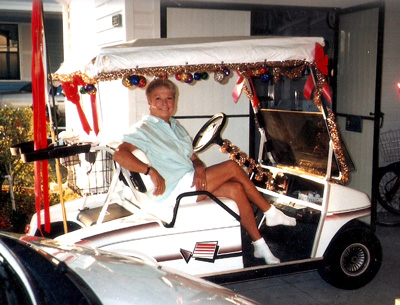 Nancy in golf cart