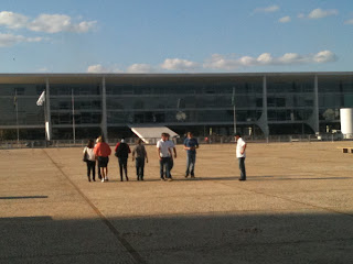 a group of people standing in a large area