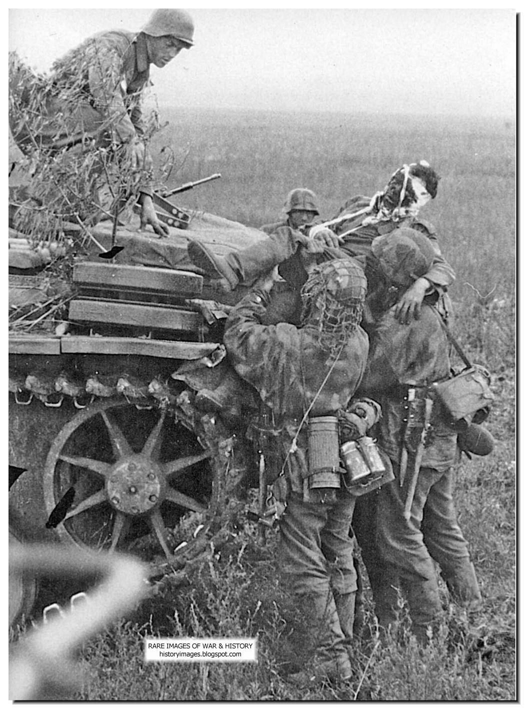SS-men-help-wounded-comrade-kursk-august-1-1943.jpg