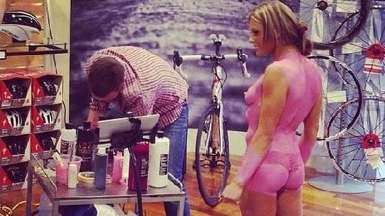 Bike store paints topless women with body paint, sparks outrage