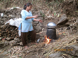 Local Gorkha agriculturist Miss Binu.Rai distilling Liquor.