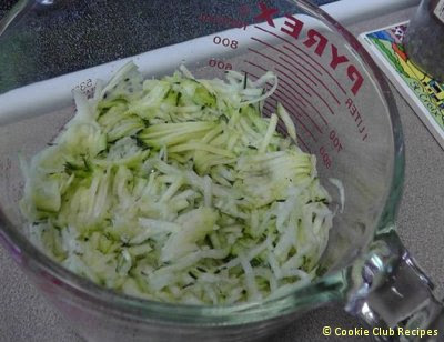 zucchini grated in measuring cup