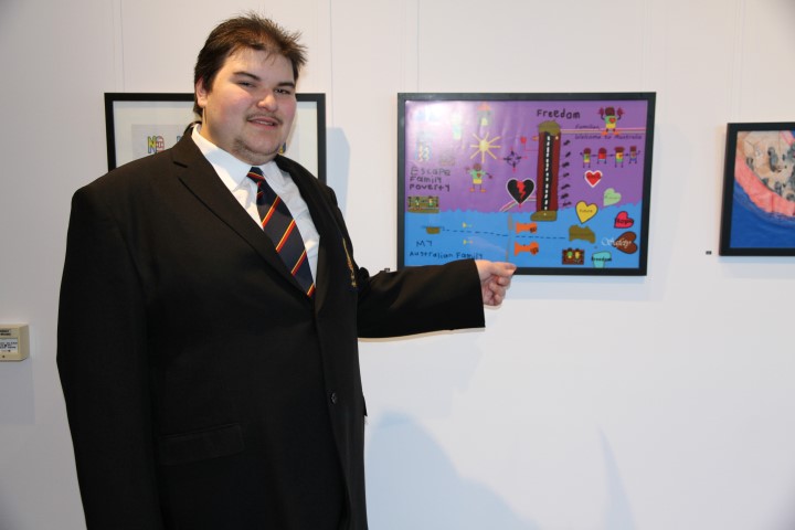 Ryan proudly showcasing his poster at the Kerry Packer Civic Gallery.