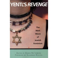 The image on the cover is the left side of a woman's neck and upper chest. She is wearing three beaded choker-type necklaces, the bottom one with a large gold Star of David. Across the top, in large white all-capital letters are the words, "Yentl's Revenge," with "revenge" in italics. On the woman's bare shoulder, in small black print is the subtitle, "The next wave of Jewish Feminism." A pale green border on the bottom says, "Edited by Danya Ruttenberg, foreward by Susannah Heschel."