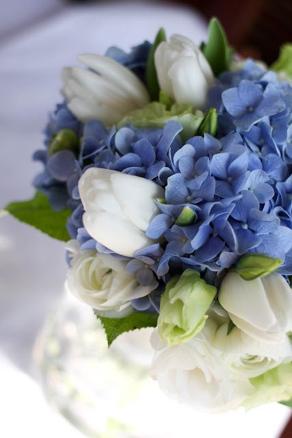 Blue hydrangea, white tulip, green eustoma and white ranunculus. Bridal bouquet by Lily Sarah 