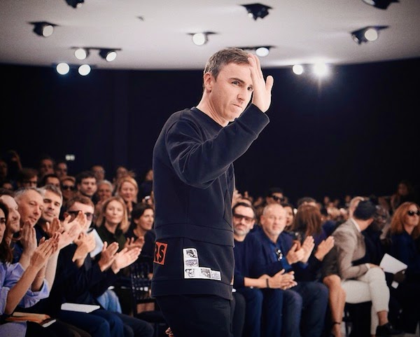 Raf Simons wears Raf Simons Fall Winter 2014 patchwork sweatshirt at Christian Dior womenswear Spring Summer 2015 show