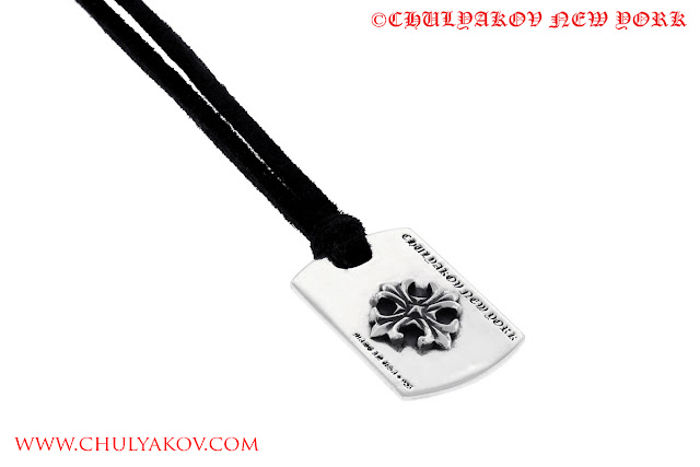 Mini 925 Sterling Silver Dog Tag with Cross on the leather cord. 
