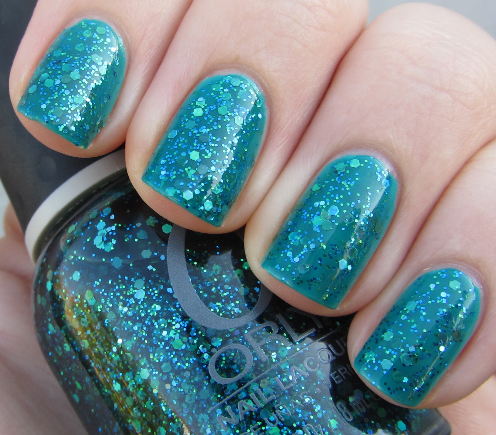 Orly Go Deeper Sheer Green Base With Aqua Shimmery Glitter Nail