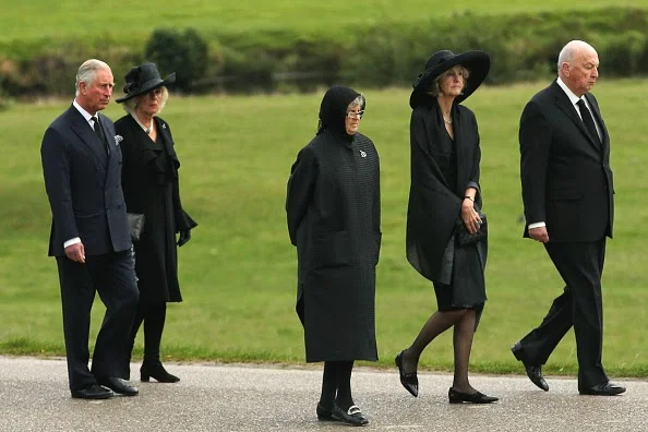 rince Charles, Prince of Wales and Camilla, Duchess of Cornwall follow the Duke of Devonshire (R), Lady Sophia Cavendish and Lady Emma Cavendish (C) as the funeral of Deborah, Dowager Duchess of Devonshire makes it's way to St Peters Church, Edensor, past Chatsworth House on 02.10.2014 in Chatsworth, England. 