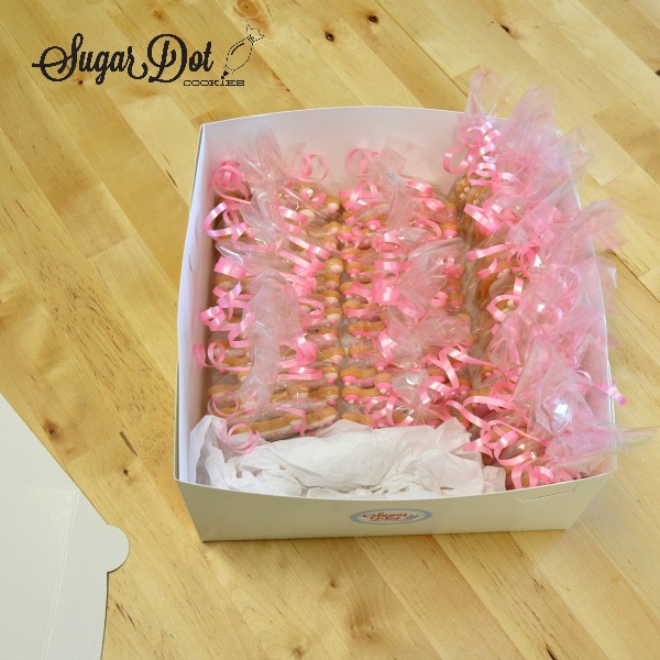 Below is a box of cookies ready for shipping. The long favor bags were