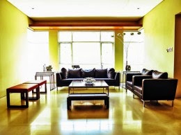 Formal living room with yellow lighting