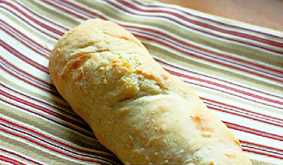 homemade baguette on a stripped napkin