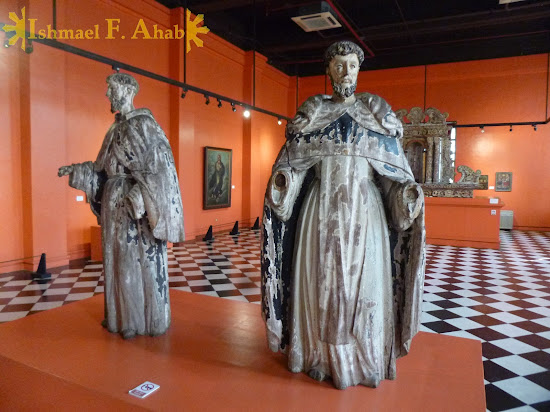 Old statues of Saint Francis and Saint Dominic in the Philippine National Museum