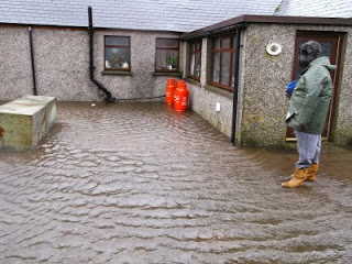 Flood waters lapping at the door of North Wald