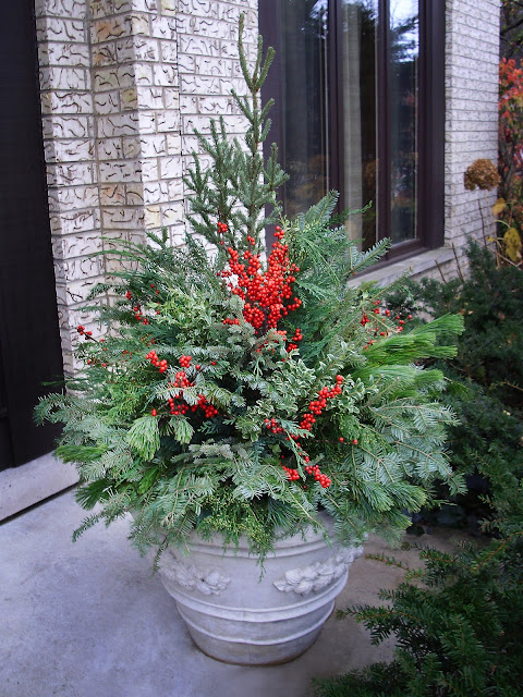 Winter pot with winterberries by Chalet Specialty Garden Care staff