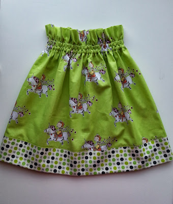 A Birthday Skirt a lime green skirt with a ruffled waist and a polka dotted hem