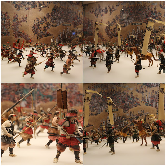 Miniature troops are arranged to tell the historical story during the Japanese war at Osaka Castle in Japan Miniature troops are arranged to tell the historical story during the Japanese war at Osaka Castle in Japan