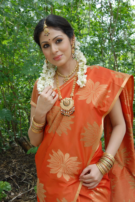 sada gorgeous in beautiful orange saree cute stills