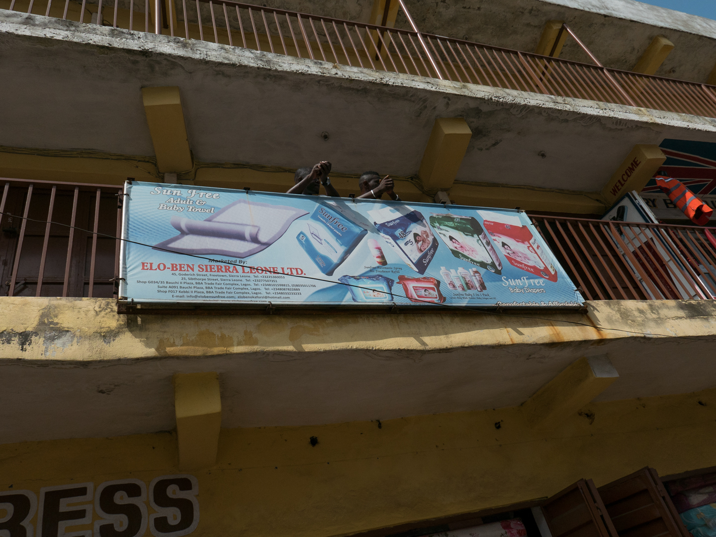 Hello Talalay Passing Buildings In Freetown, Sierra Leone