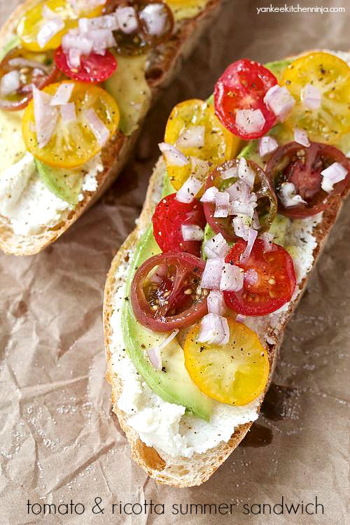 fresh tomato and ricotta summer sandwich with avocado