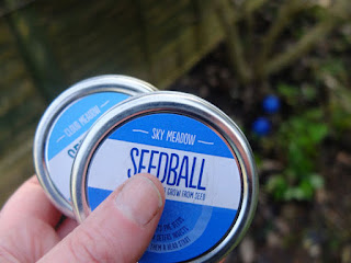 Two tins of wild flower seedballs