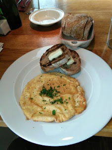 Omelette with bread in "Kitchen restaurant in Vilnius.