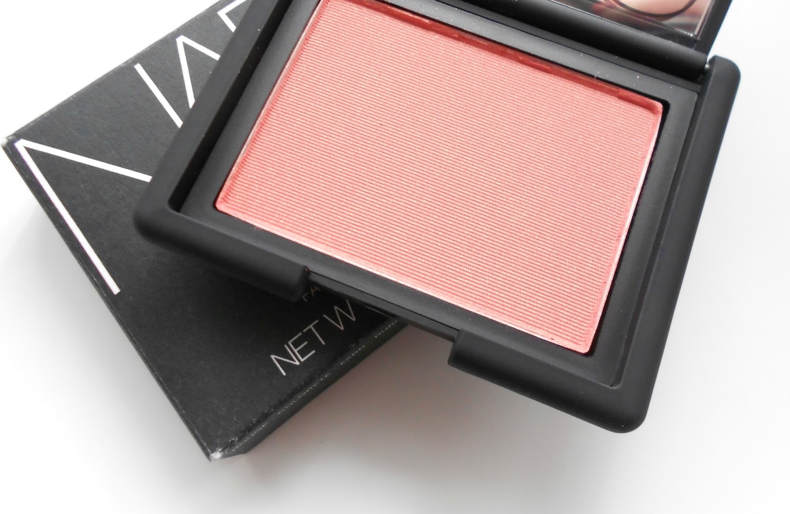 Nars torrid blush review swatches on cheeks