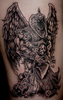 arm tattoo: Angel of Death portrayed as a winged warrior-monster