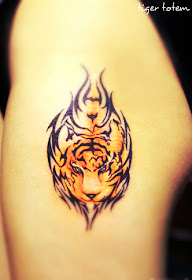 a face of tiger tattoo surrounded by totem