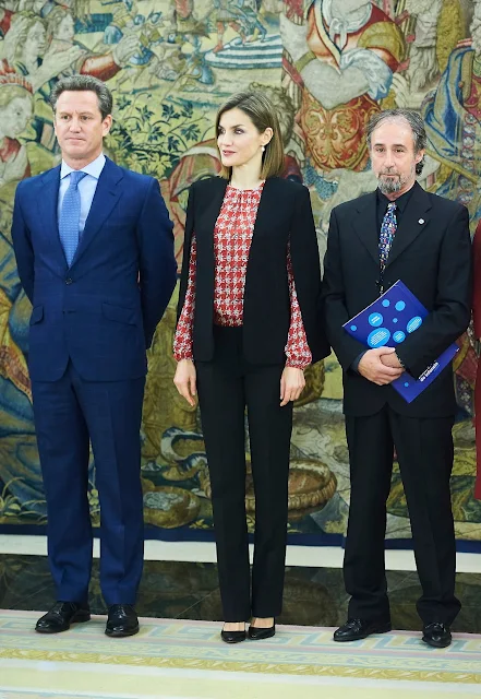 Queen Letizia  attends an audience with a Representation of Gypsy Secretariat Foundation at Zarzuela Palace. Queen Letizia wore ZARA Cape Jacket - HUGO BOSS Taru Trousers - Magrit pumps Tous Jewelery