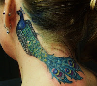 peacock tattoo behind ears