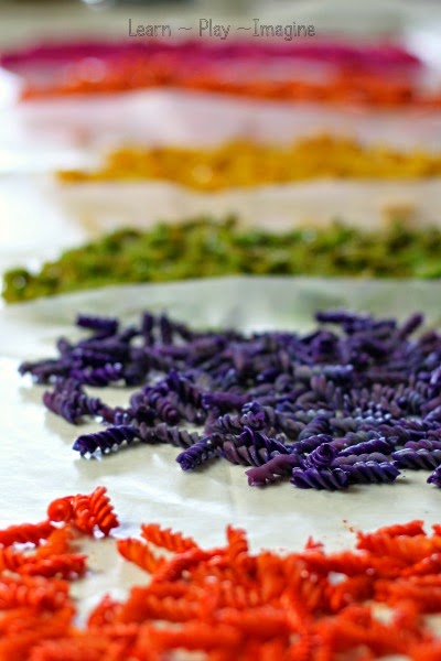 Gorgeous dyed pasta for sensory play - check out the surprise method used to achieve these colors!