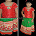 Baby in Green and Red Skirt