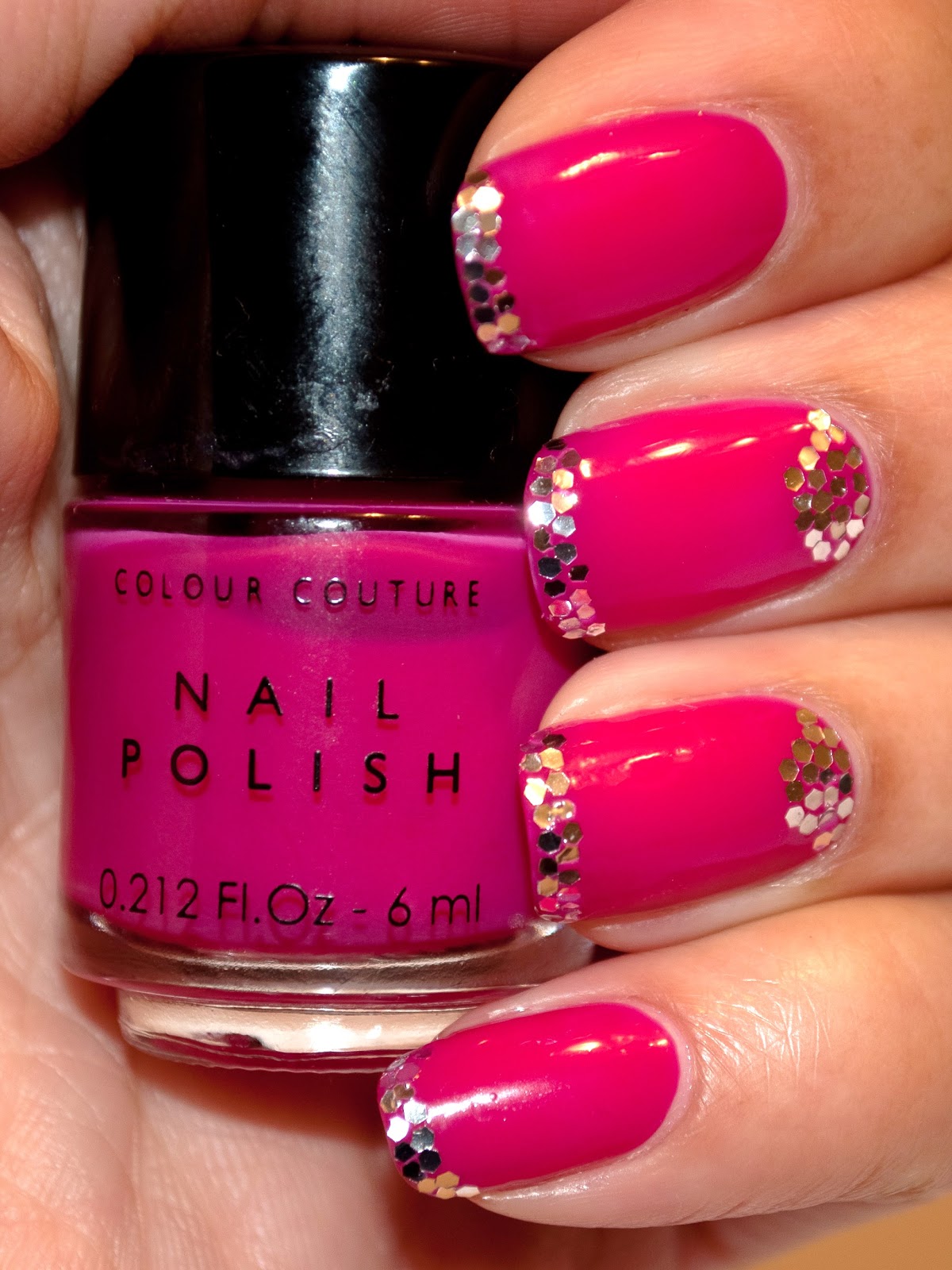 Pink nails, glitter tips. 