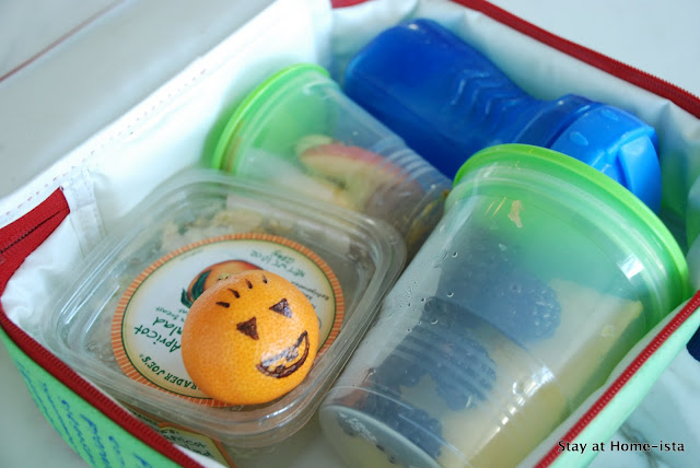 Use a Sharpie to make a jack-lantern face on a clementine