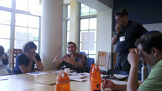 Rabbi David Kasher teaching at the second annual Hillel Institute while Rabbi Shmuly Yanklowitz looks on pensively